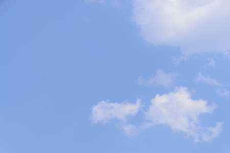 White fluffy clouds in  blue sky and spaceの写真素材
