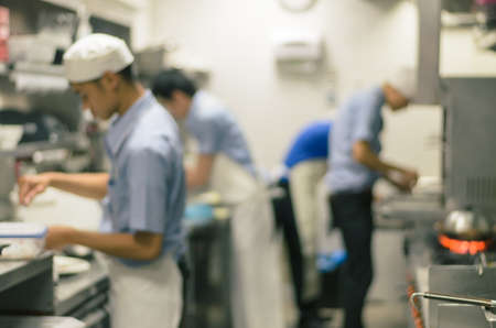 Blurred restaurant kitchen,Chef cooking food and preparing in japan shopの写真素材