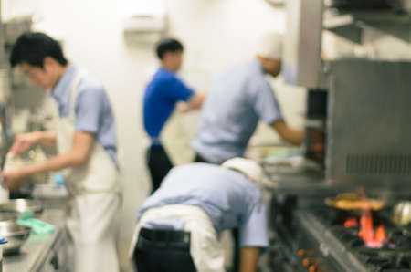 Blurred restaurant kitchen,Chef cooking food and preparing in japan shopの写真素材