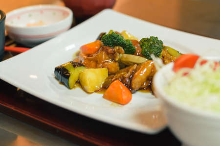 Chicken and vegetable 
intermix in vinegar sauce  put on white plateの写真素材