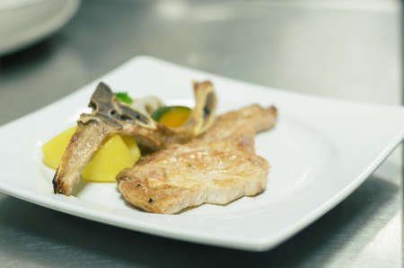 Pork steak grill put in white plateの写真素材