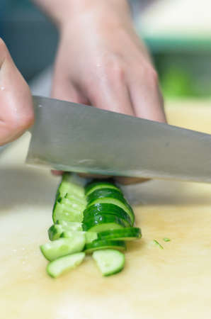 Chef cutting cucumber with skillfully and cutting fastの写真素材