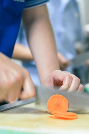 Chef cutting carrot with skillfully and cutting fastの写真素材