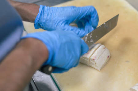 Chef cutting radish with skillfully and cutting fastの写真素材