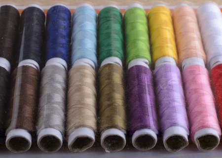Sewing threads stand in a line color