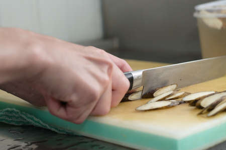 Hands are chopping vegetablesの写真素材