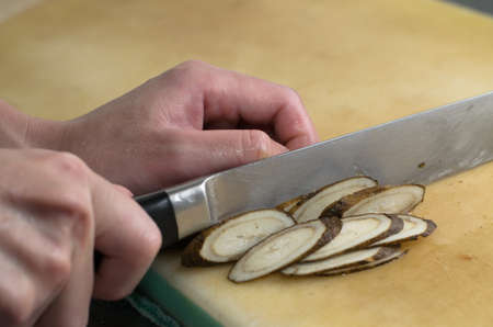 Hands are chopping vegetablesの写真素材