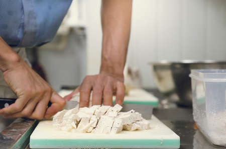 Chef professional cut taro  on cutting board with knife japanの写真素材