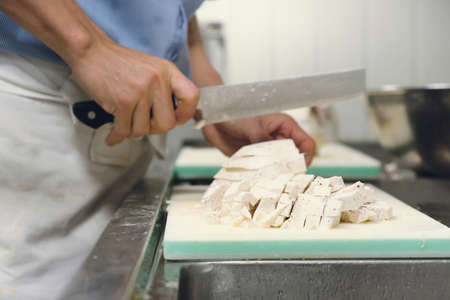 Chef professional cut taro  on cutting board with knife japanの写真素材