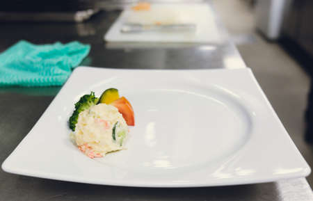 salad potato put on white dishの写真素材