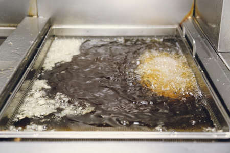 Deep fryer in oil  restaurantの写真素材