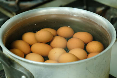 egg boil in potの写真素材