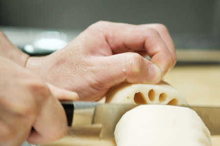 Chef training cut vegetable on cutting board with knife japanの写真素材