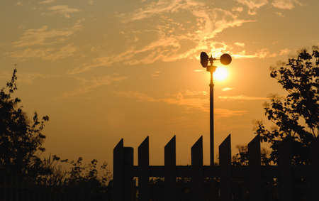Wind turbine, silhouette in sunset and sunriseの写真素材