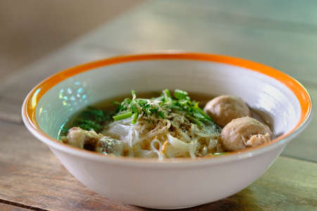 Noodle and soup in bowl put on the tabl