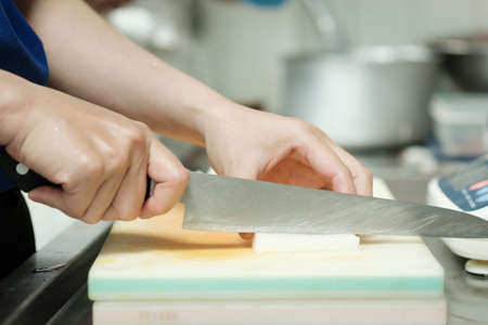 Chef cut vegetable on cutting board with knife japan,slicing radishの写真素材