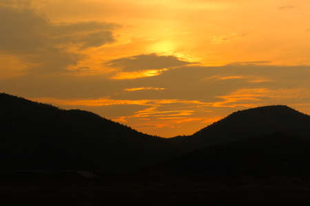 Silhouette of mountains sunsetの写真素材