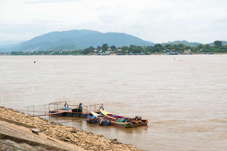The long-tail boat is waiting for the passengers,North THAILAND MAE KHONG riverの写真素材