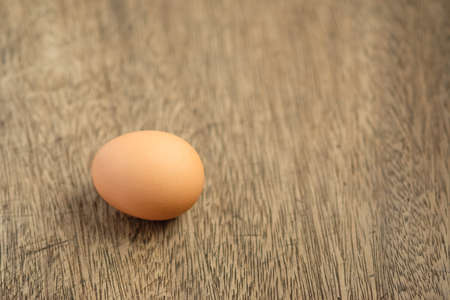 Eggs on the wooden background and copy spaceの写真素材