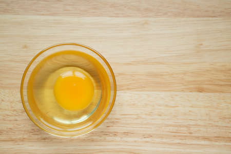 Eggs in a cup Lay on the wooden background and copy spaceの写真素材