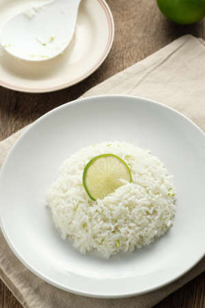 Cilantro lime in white dish,lemon on riceの写真素材