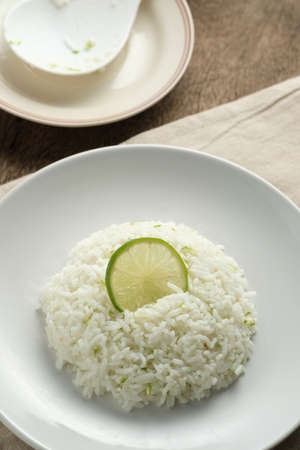 Cilantro lime in white dish,lemon on riceの写真素材