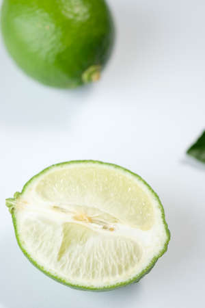 Fresh half lime on white background and copy spaceの写真素材