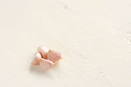 Close up garlic on white backdrop,Allium sativum is a bulbous plantの写真素材
