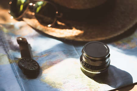Traveling concept accessories for tourism,Lens on map with sun lightの写真素材