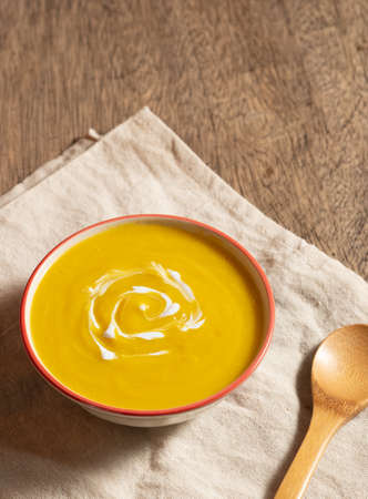 Vegetarian food in autumn season,pumpkin mash for making soup in bowlの写真素材