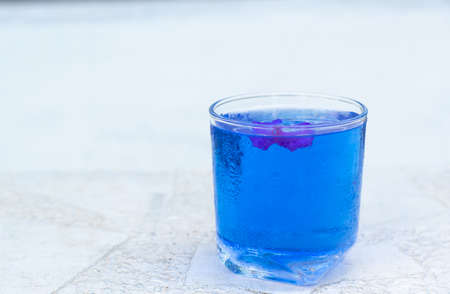 Butterfly pea water on white table and copy spaceの写真素材