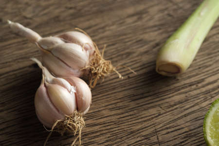 Close up garlic on wooden boardの写真素材