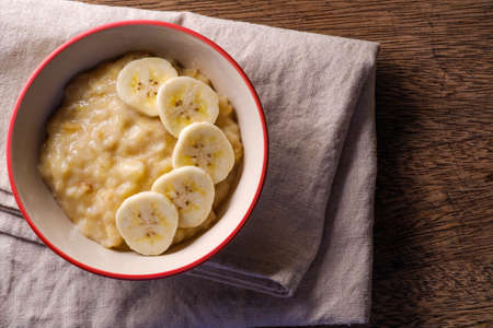 mashed bananas in bowl and copy space top view foodの写真素材