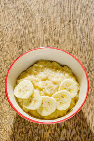 Close up mashed bananas in bowlの写真素材