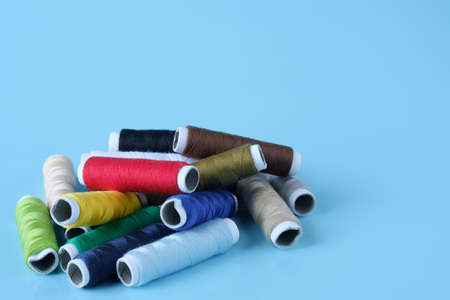 Thread tube colorful on blue backgroundの写真素材