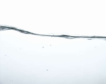 Water splash with bubbles of air and waveの写真素材