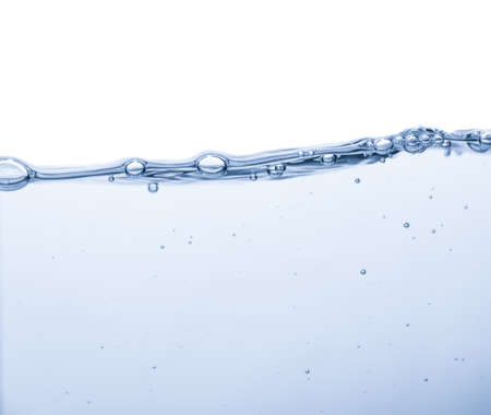 Water splash with bubbles of air and waveの写真素材