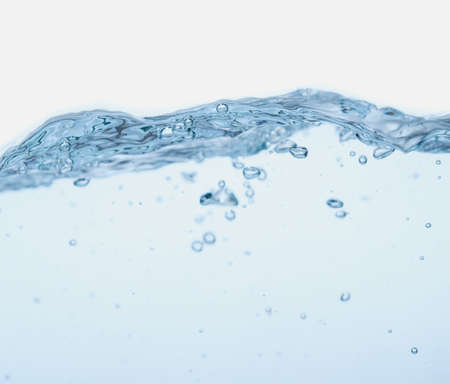 Water splash with bubbles of air and waveの写真素材