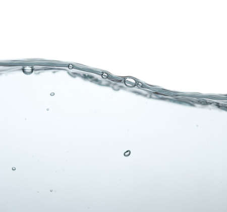 Water splash with bubbles of air and waveの写真素材