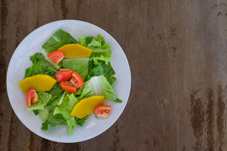 Mix salad vegetable  in white dish,vegan copy spaceの写真素材