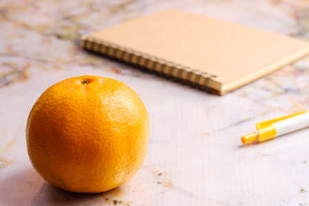 Orange on wooden table and copy space