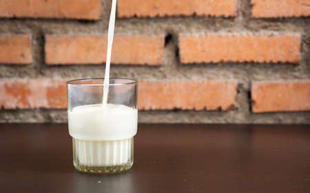 Pour the soymilk into the glass and copy spaceの写真素材
