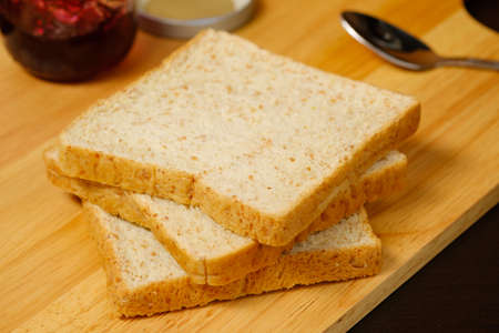 Bread sliced on wooden boardの写真素材