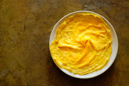 Top view scrambled egg in dish with copy space