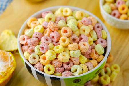 Cereal flakes in bowl Breakfast concept.Food with delicious fruity taste and fruity colours.It's made with maize,wheat,and barleyの写真素材
