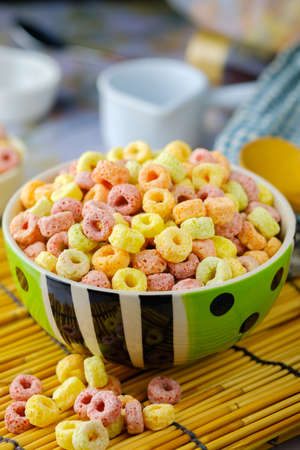 Cereal flakes in bowl with copy space,Breakfast concept.Food with delicious fruity taste and fruity colours.It's made with maize,wheat,and barleyの写真素材