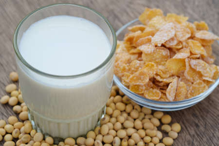 Soymilk in glass on the table with copy space.breakfast concept.soybeans dry on tableの写真素材