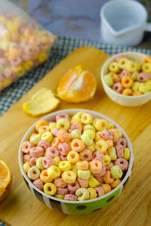 Cereal flakes in bowl with copy space,Breakfast concept.Food with delicious fruity taste and fruity colours.It's made with maize,wheat,and barleyの写真素材