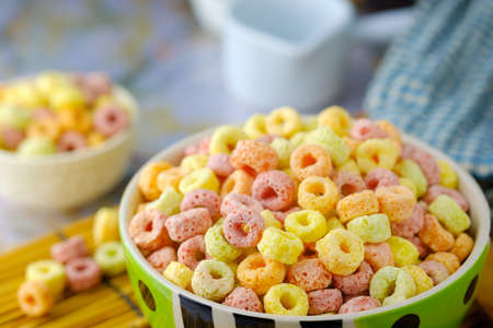 Cereal flakes in bowl with copy space,Breakfast concept.Food with delicious fruity taste and fruity colours.It's made with maize,wheat,and barleyの写真素材
