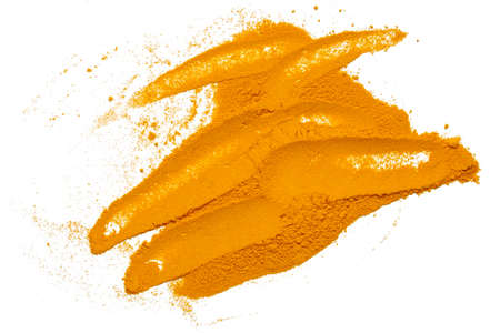 Dry turmeric powder isolated on white background.Close-up of powder orange color turmeric.top view